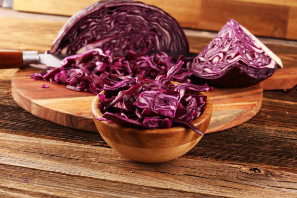 istock Chopped fresh red cabbage. Prepare sliced vegetable for cooking purple cabbage salad or coleslaw. Homemade food concept. 1250088819