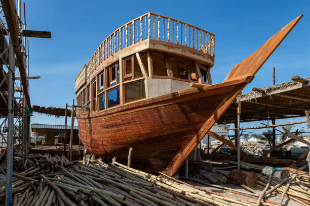 Traditional dhow under construction in wharf in Sur in Oman