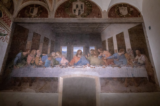 Milan, Italy - June 27, 2018: Interior of refectory of the convent Santa Maria delle grazie (Holy Mary of Grace), on wall mural of The Last Supper by Leonardo da Vinci