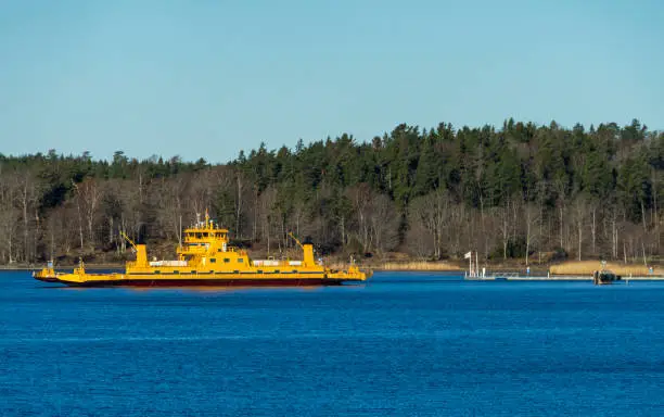 Yellow ferry for transporting cars and people from the islands of the Stockholm archipelago to the mainland