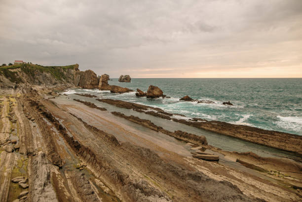 istock Arnia cliffs in Cantabria, Spain, at sunset 1250097260