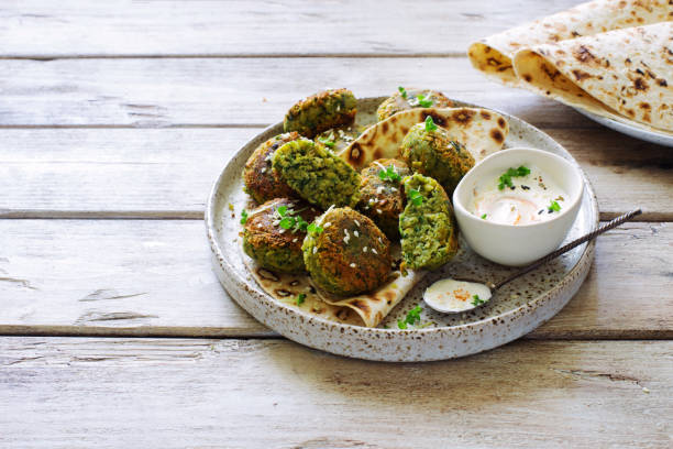 Roasted chickpeas falafel patties on grunge clay plate close up stock photo