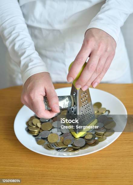Exchange Dollars For Cents Using A Grater Stock Photo - Download Image Now - Banking, Budget, Business