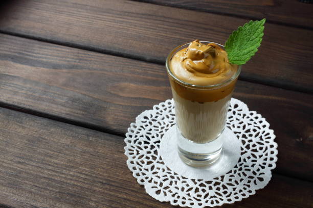 istock One glass with a dalgona coffee cocktail with mint leaf 1250112525