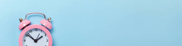 istock Simply minimal design ringing twin bell classic alarm clock Isolated on blue pastel background. Rest hours time of life good morning night wake up awake concept. Flat lay top view copy space, banner 1250114683