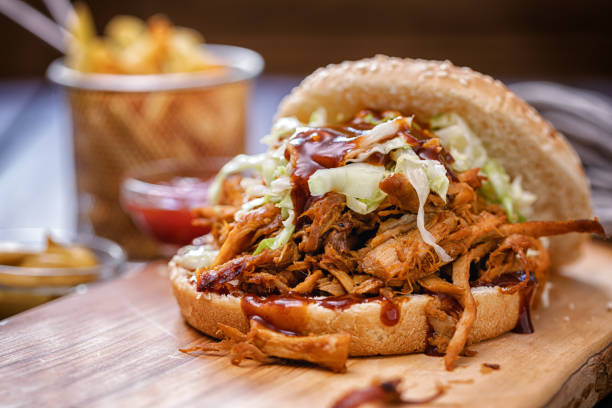 istock Homemade Pulled Pork Sandwich with Coleslaw and Barbecue Sauce 1250117476