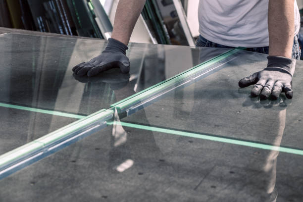 istock glazier breaking glass on a professional table 1250118129