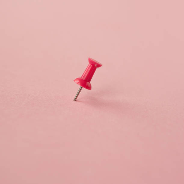 istock Scattered pink paper pin. Pink background. Copy space 1250123543