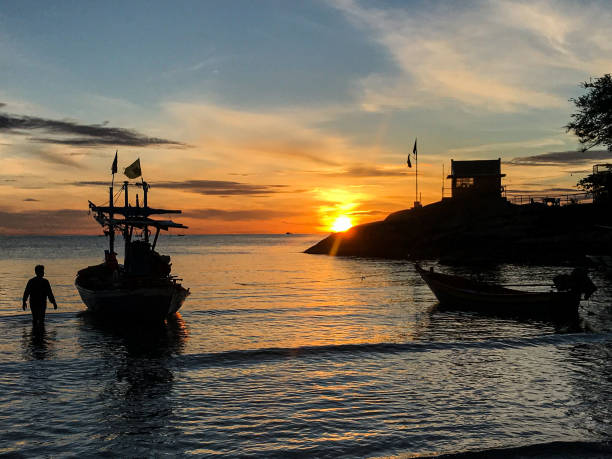 istock Fishing boat as the sunrises 1250125402
