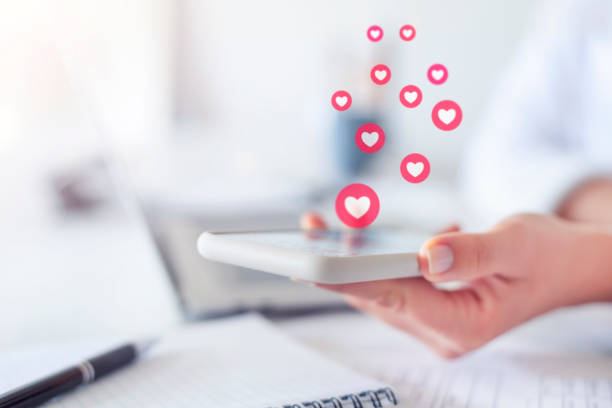 istock Woman using mobile phone and getting lots of likes. 1250126785