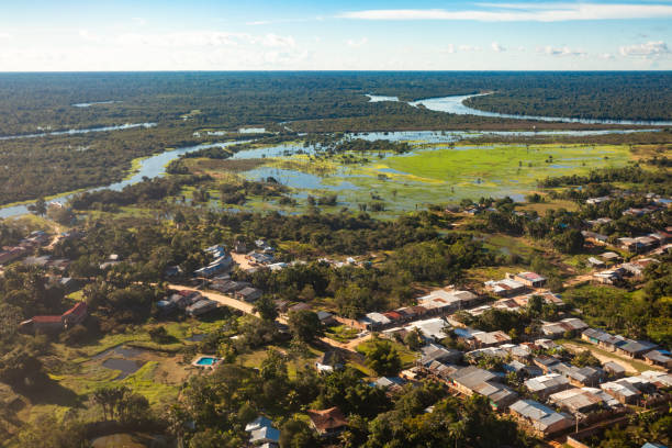 view of the city of iquitos, on the amazonas river from an airplane. - iquitos imagens e fotografias de stock