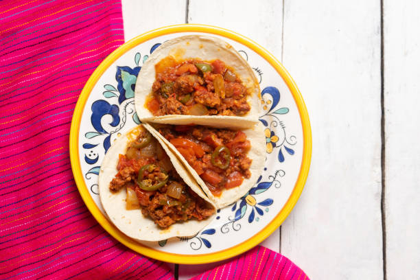 istock Mexican chorizo tacos on white background 1250128640