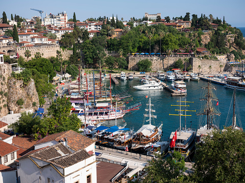 Antalya is a Turkish resort city with a yacht-filled Old Harbor and beaches flanked by large hotels. It's a gateway to Turkey's southern Mediterranean region, known as the Turquoise Coast for its blue waters. Remnants remain from Antalya's time as a major Roman port. These include Hadrian\
