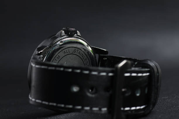 istock A black battery operated watch on black leather background 1250131884