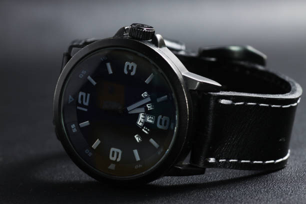 istock A black battery operated watch on black leather background 1250131949
