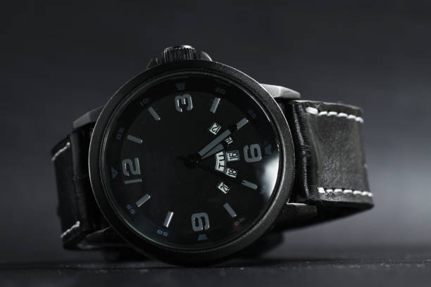 istock A black battery operated watch on black leather background 1250131983