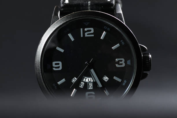 istock A black battery operated watch on black leather background 1250132004