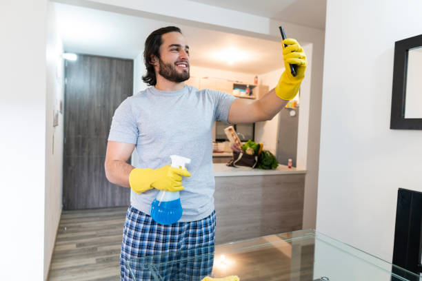 istock Man using toiletries, talking on cell phone 1250136329