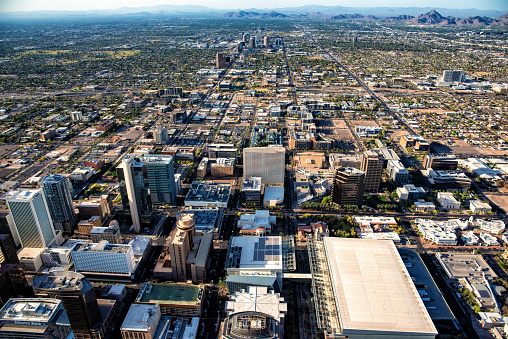 An aerial view of downtown Phoenix, Arizona and the surrounding urban communities from an altitude of about 1200 feet up.