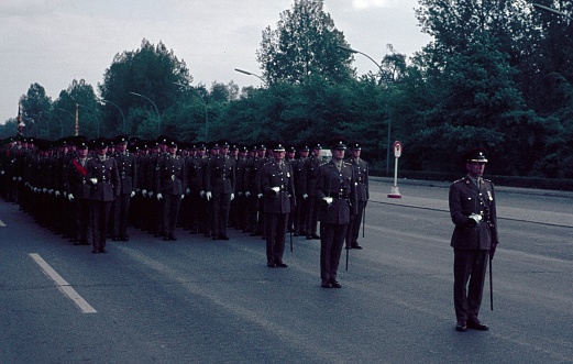 Tiergarten, Berlin (West), Germany, 1965. Allied military parade in the Tiergarten in West Berlin. British soldiers and officers stand by and wait for the start of the parade on \