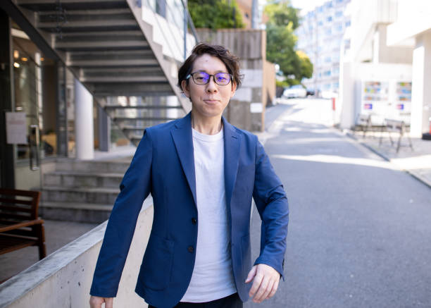 istock Young businessman walking in city 1250138116