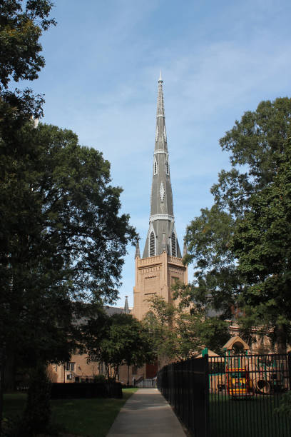istock Charlotte church steeple through trees 1250138204