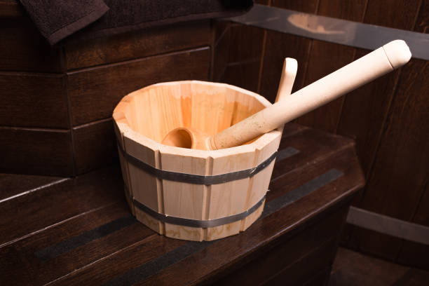 istock A white tub sitting next to a wooden table 1250139080