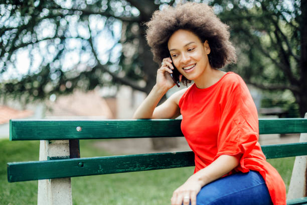 istock Happy African American female using a smart phone 1250139173