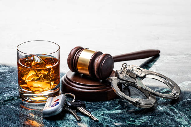 Drinking and Driving Handcuffs and Gavel on Marble Background Drinking and Driving Handcuffs and Gavel on Marble Background alcoholics anonymous photos stock pictures, royalty-free photos & images