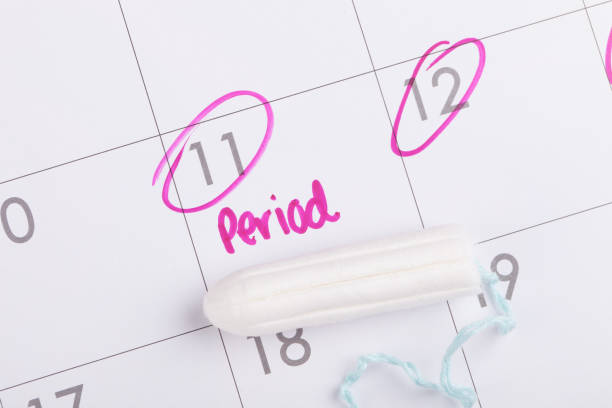istock Period due date marked on calendar in pink 1250143929