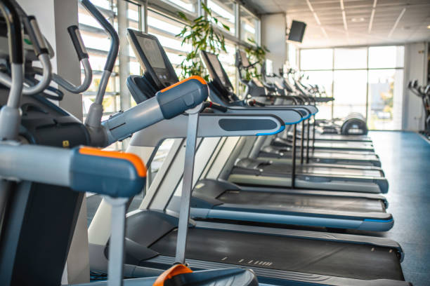 istock Side View of Treadmills at Modern Gym 1250144002