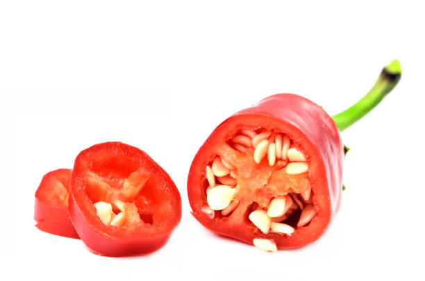 istock Half pieced chilli pepper with seeds and slices isolated on white background. 1250144290