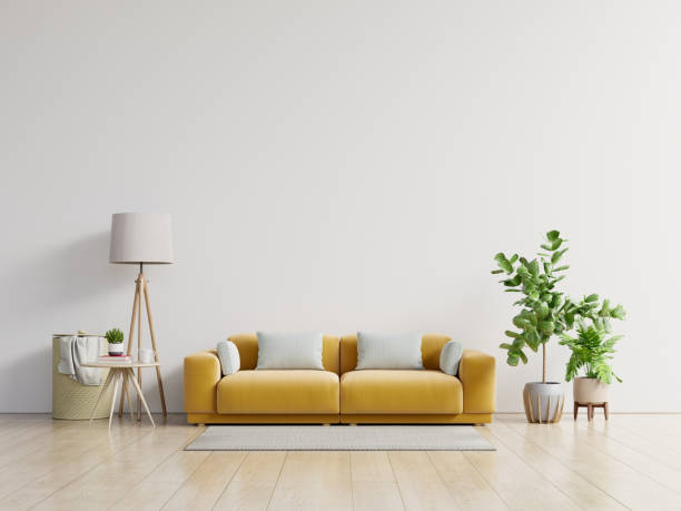 istock Empty living room with yellow sofa, plants and table on empty white wall background. 1250148447