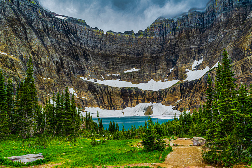 5153a A path leads to the emerald blue water of Iceberg Lake at Glacier National Park, Montana