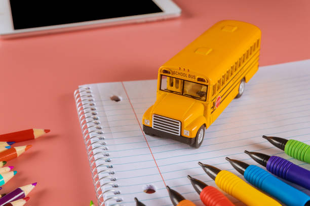 istock Back to school concept with bus and notebook pencil 1250148540
