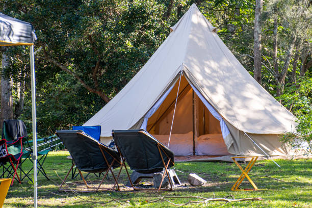 istock Glamping camping teepee tent and chairs at the campsite 1250148549