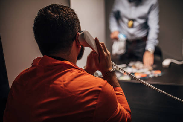 istock Inmate talking with detective in prison visit room 1250149390