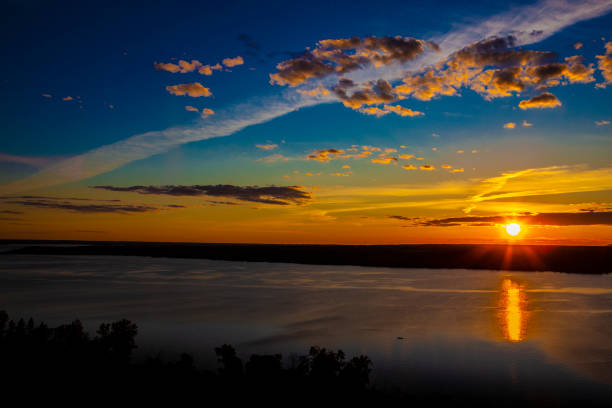 Sunset and clouds Sunset and clouds over the Ottawa River. ottawa river stock pictures, royalty-free photos & images