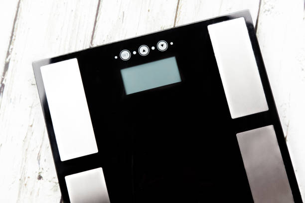 istock Black scales on white floor boards 1250158373