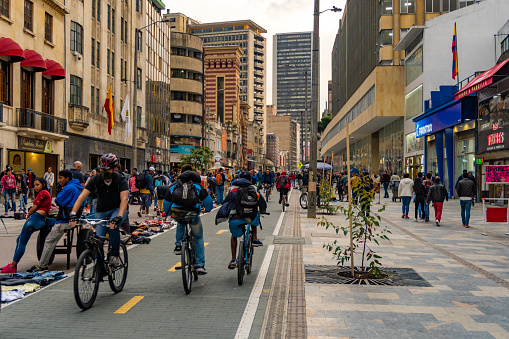 Pedestrianized central city street with cycleway that forms part of a network of bikeways known as the Ciclovia, and is part of a transformation project to prioritize sustainable mobility in the city of Bogota, Colombia