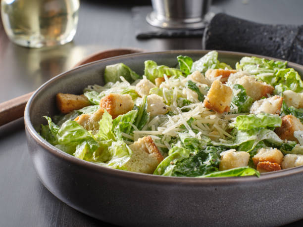 istock fresh caesar salad with croutons and Parmesan cheese in bowl 1250162627