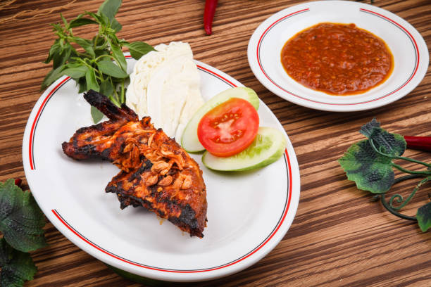 istock Ayam Bakar or grilled chicken with hot sauce 1250166366