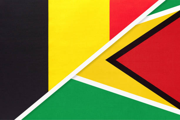 istock Belgium and Guyana, symbol of two national flags from textile. Championship between two countries. 1250166993