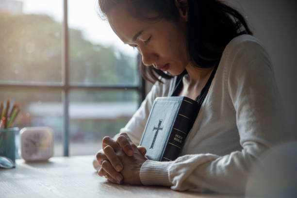 istock Prayer and bible in New Normal concept 1250168531