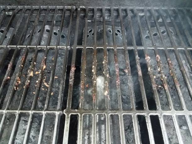 istock dirty or filthy bars on barbecue grill wih smoke 1250169752