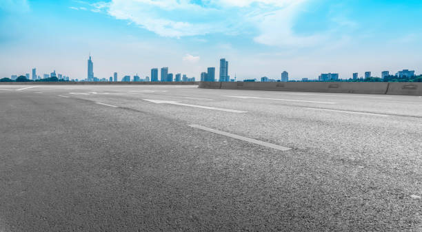 istock Road surface and urban architectural landscape 1250172849