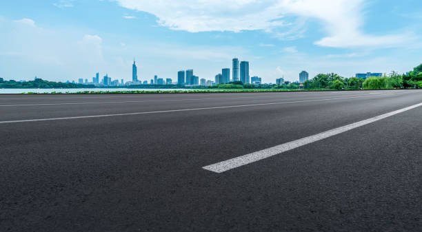 istock Road surface and high-rise buildings 1250174904
