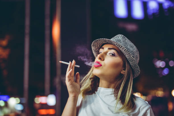 istock Pretty hipster woman with cigarette 1250175125