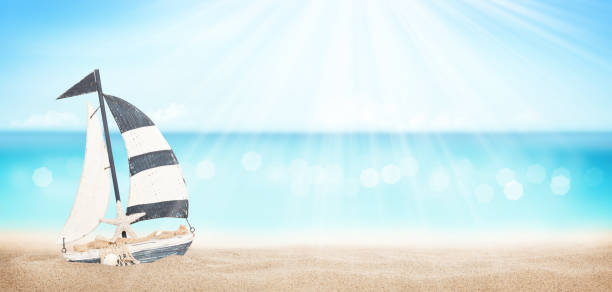istock Summer tropical sea with sparkling waves and sailing ship toy 1250175189