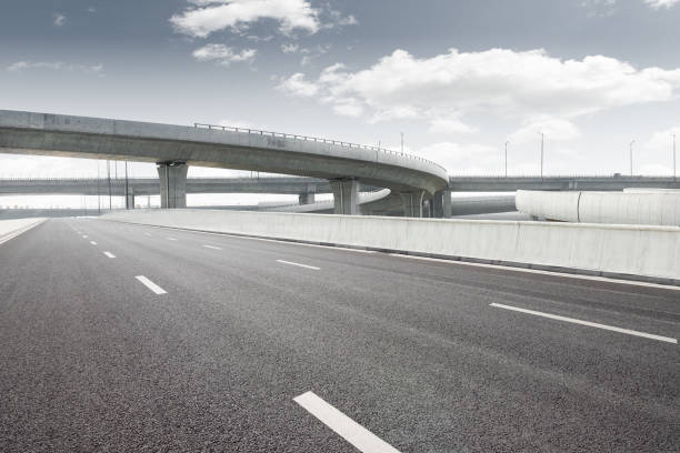 istock Clear blue sky and white clouds in the background, highway overpass curved approach bridge 1250178319